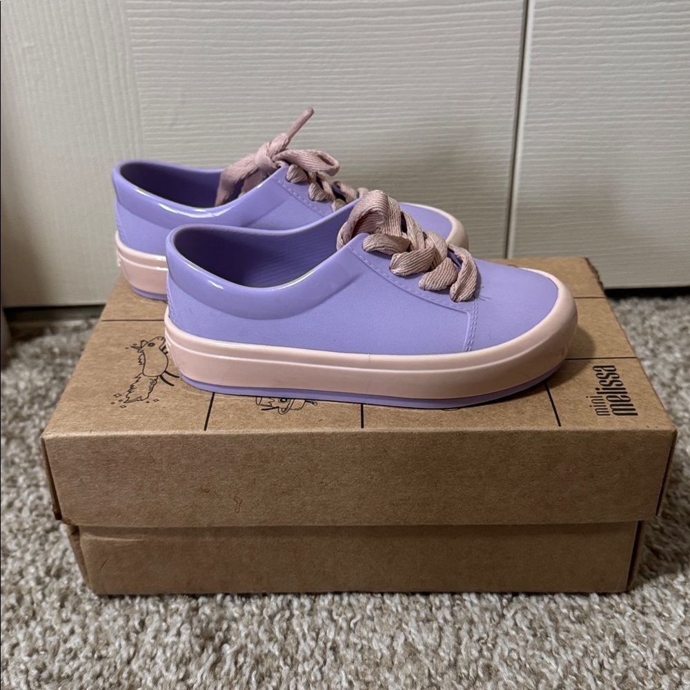 Mini Melissa Kids Lavender and Pink Sneakers
Slightly used 
In good condition